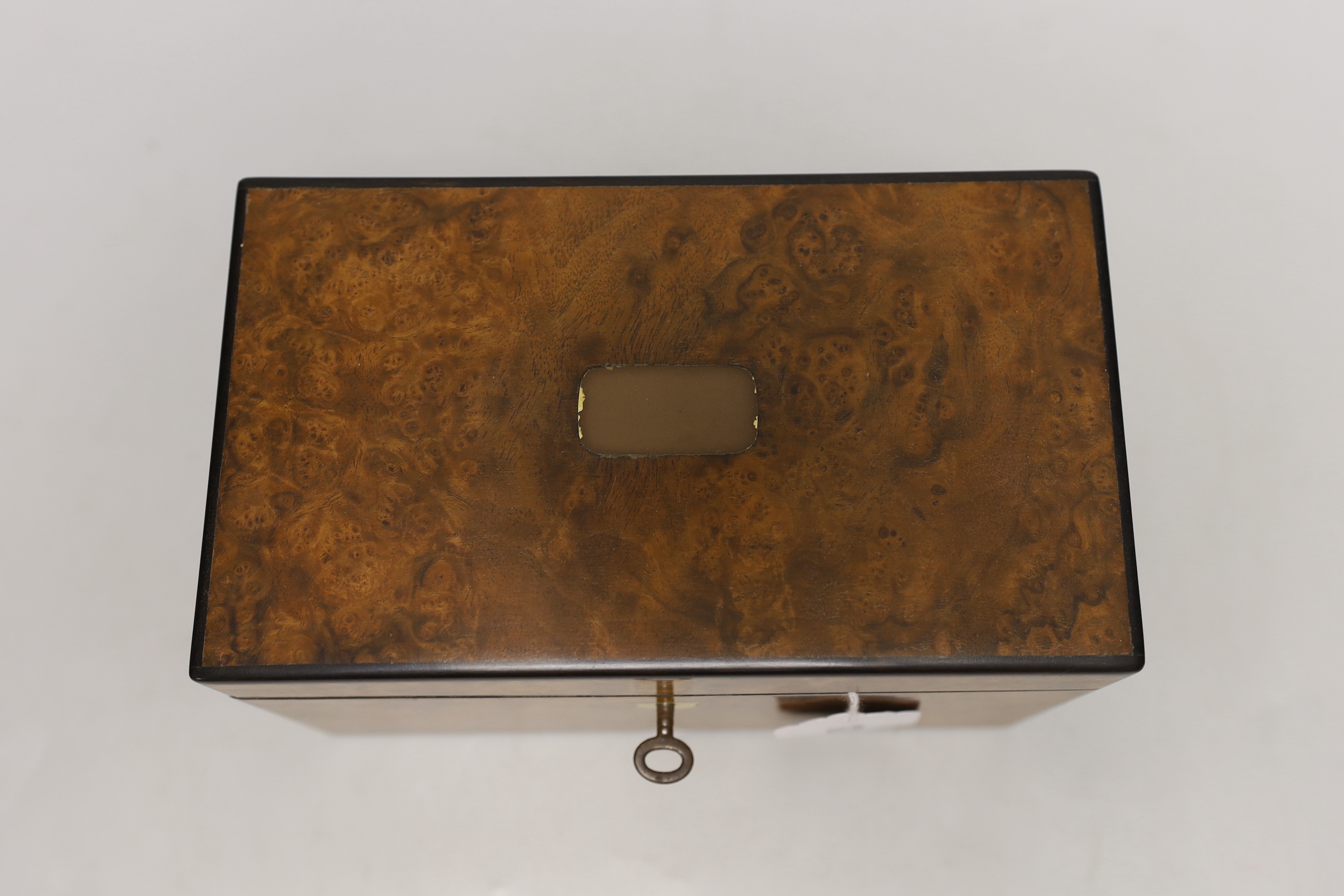 A 19th century burr walnut veneered tea caddy, with divisional interior and internal covers, 20cm wide